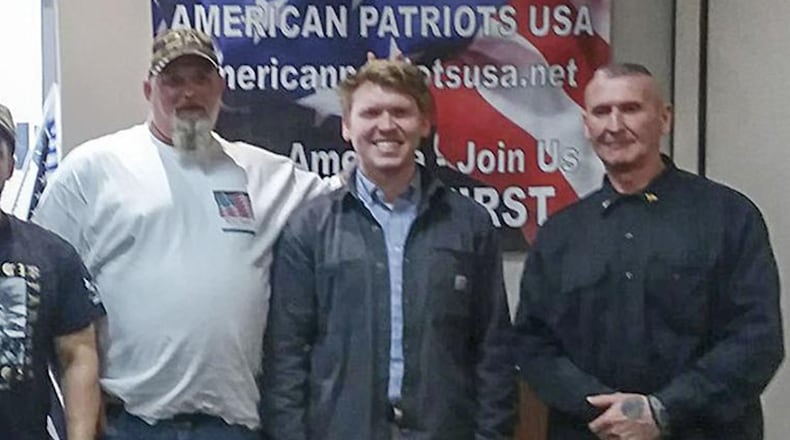 Georgia state Rep. Matt Gurtler (center), one of the leading candidate in the U.S. House seat being vacated by Doug Collins, attended an event sponsored by American Patriots USA, founded by Chester Doles (right). Doles is a Georgia man with longstanding ties to extremist groups. Michael Boggus (left), is a militia member and another candidate in the race.
