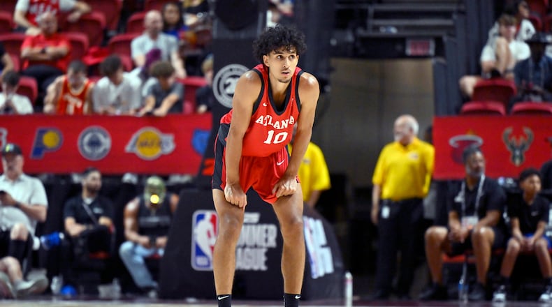 Atlanta Hawks forward Zaccharie Risacher (10) looks on from midcourt during the second half of an NBA summer league basketball game against the Washington Wizards Friday, July 12, 2024, in Las Vegas. (AP Photo/David Becker)