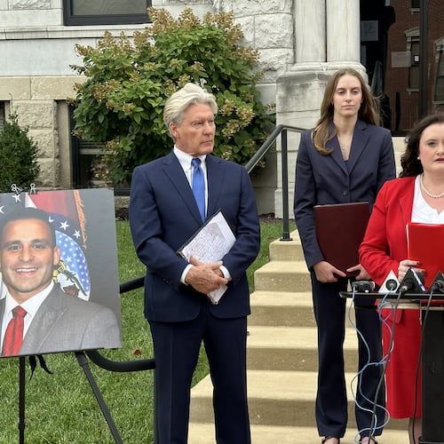 This photo taken with a smartphone shows attorney Erin N. Vernon speaking with reporters Monday, Sept. 14, 2026, at the Cole County Courthouse in Jefferson City, Mo. (AP Photo/David A. Lieb)