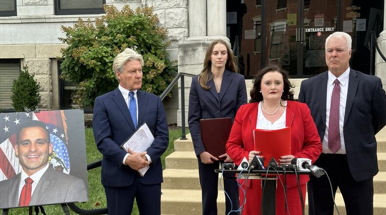 This photo taken with a smartphone shows attorney Erin N. Vernon speaking with reporters Monday, Sept. 14, 2026, at the Cole County Courthouse in Jefferson City, Mo. (AP Photo/David A. Lieb)