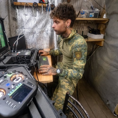 A Ukrainian serviceman of Khartia brigade controls an interceptor drone in the command centre Kharkiv region, Ukraine, Friday, June 26, 2026. (AP Photo/Andrii Marienko)