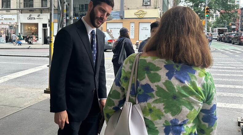 New York Assemblymember Alex Bores campaigns for the Democratic nomination for Congress in New York City on Monday, June 22, 2026. (AP Photo/Anthony Izaguirre)