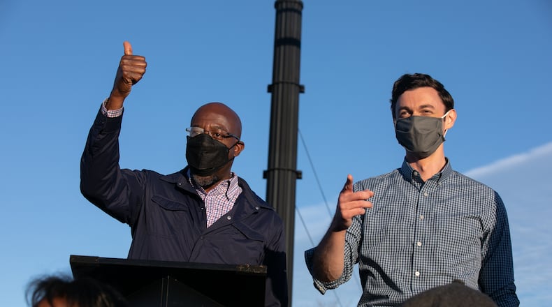 Democratic U.S. Senate candidates Jon Ossoff (R) and Raphael Warnock (L) of Georgia hold a rally on November 15, 2020 in Marietta, Georgia. Ossoff and Warnock face incumbent U.S. Sens. David Purdue (R-GA) and Kelly Loeffler (R-GA) respectively in a January 5 runoff election. (Jessica McGowan/Getty Images/TNS)
