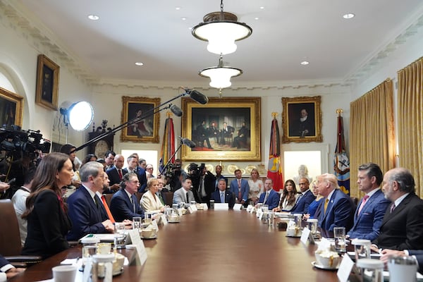 President Donald Trump, right seated, speaks during a cabinet meeting at the White House, Tuesday, July 8, 2025, in Washington. (AP Photo/Evan Vucci)