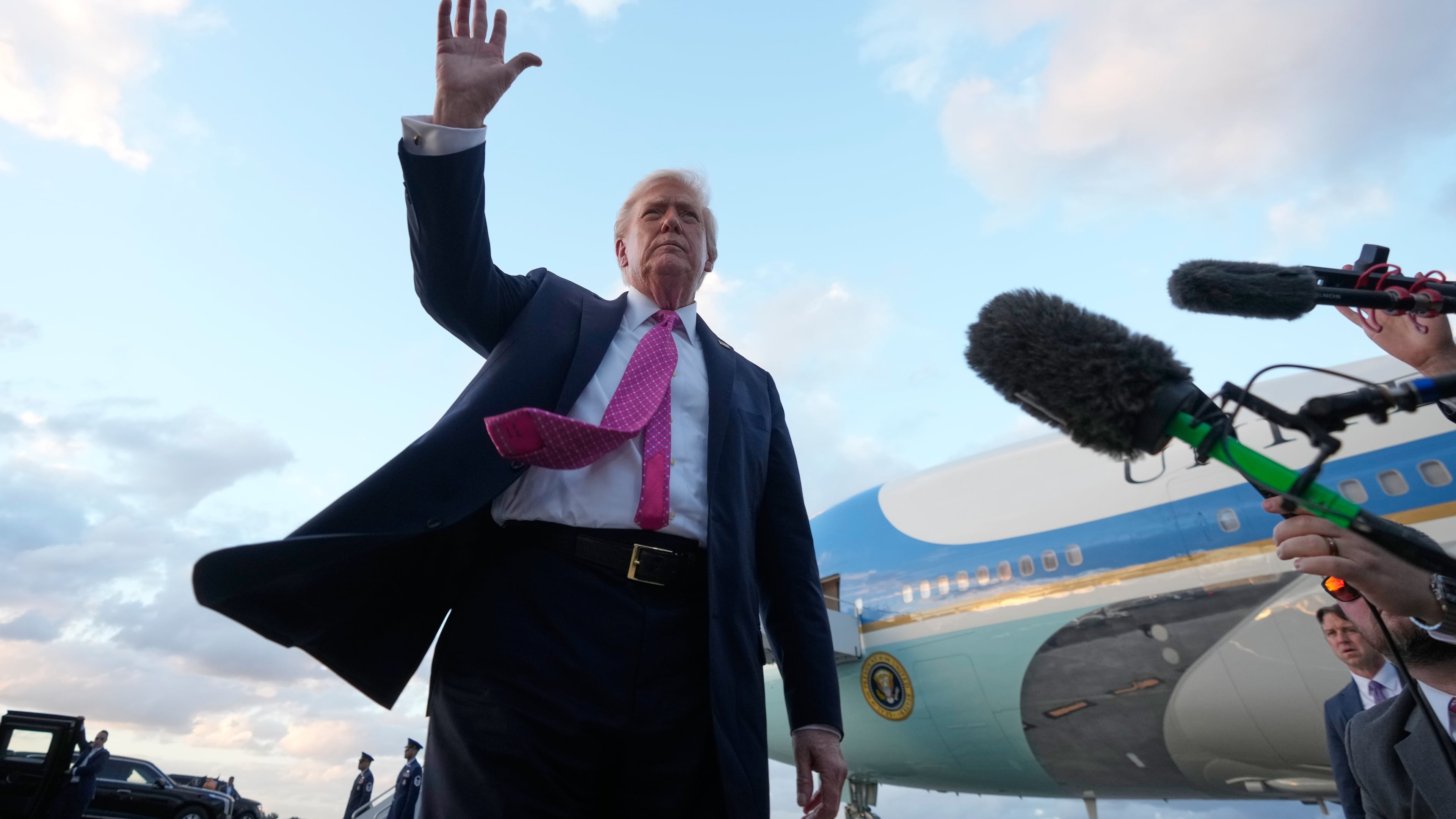 President Donald Trump waves after arriving on Air Force One, Friday, Oct. 17, 2025, at Palm Beach International Airport in West Palm Beach, Fla. (AP Photo/Mark Schiefelbein)