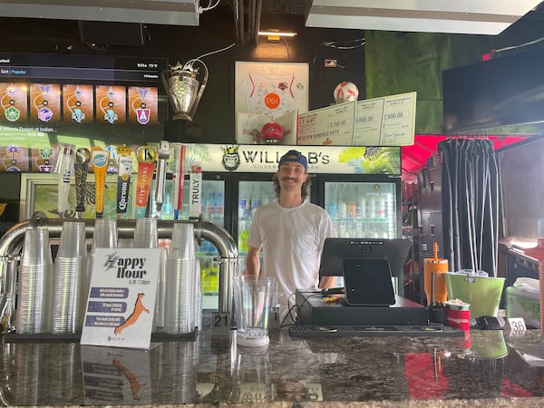 Dakota Heaton, who works as a bartender at Willie B’s Bar and Grill, said Friday's storm knocked the power out, forcing the restaurant to close early. (Chaya Tong/AJC)