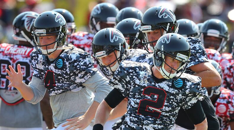 Then-Falcons quarterback Matt Ryan leads the team through an agility drill during Military Day in August 2017 at the team's football practice facility in Flowery Branch. (Curtis Compton/Atlanta Journal-Constitution via AP)