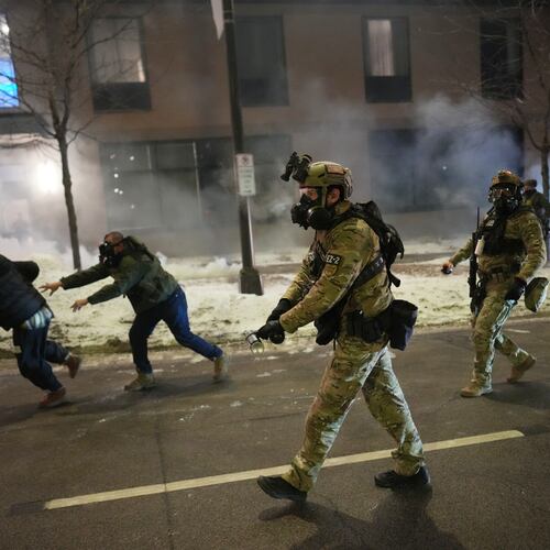 Federal agents try to clear demonstrators near a hotel, using tear gas during a noise demonstration protest in response to federal immigration enforcement operations in the city Sunday, Jan. 25, 2026, in Minneapolis, Minn. (Adam Gray/AP)