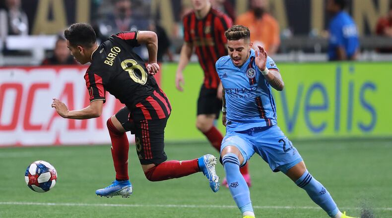 Atlanta United midfielder Ezequiel Barco steals from New York City FC defender Ronald Matarrita in their soccer match on Sunday, August 11, 2019, in Atlanta.   Curtis Compton/ccompton@ajc.com