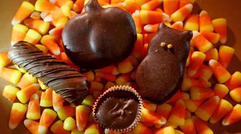 From left, a homemade Twix-like candy bar, a coconut chocolate bar, a peppermint patty owl, and a peanut butter cup on the bottom. Use cookie cutters for other creative holiday-themed shapes. (Francine Orr/Los Angeles Times/TNS)