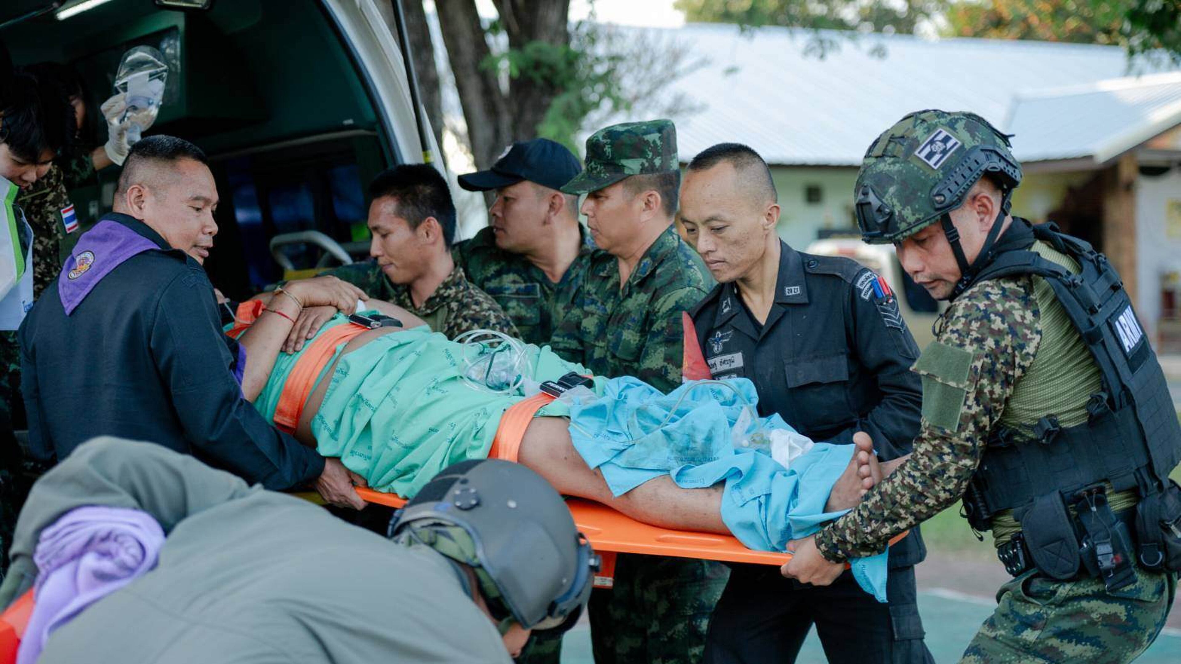 In this photo released by Royal Thai Army, a wounded Thai soldier is carried to be transferred to a hospital in Sisaket province, Thailand, Sunday, Dec. 7, 2025, after, according to a Thai army spokesperson, Cambodian troops fired into Thai territory. (Royal Thai Army via AP)