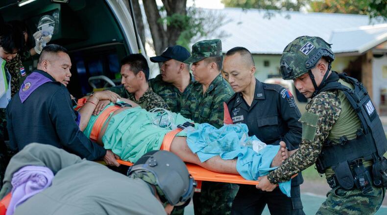 In this photo released by Royal Thai Army, a wounded Thai soldier is carried to be transferred to a hospital in Sisaket province, Thailand, Sunday, Dec. 7, 2025, after, according to a Thai army spokesperson, Cambodian troops fired into Thai territory. (Royal Thai Army via AP)