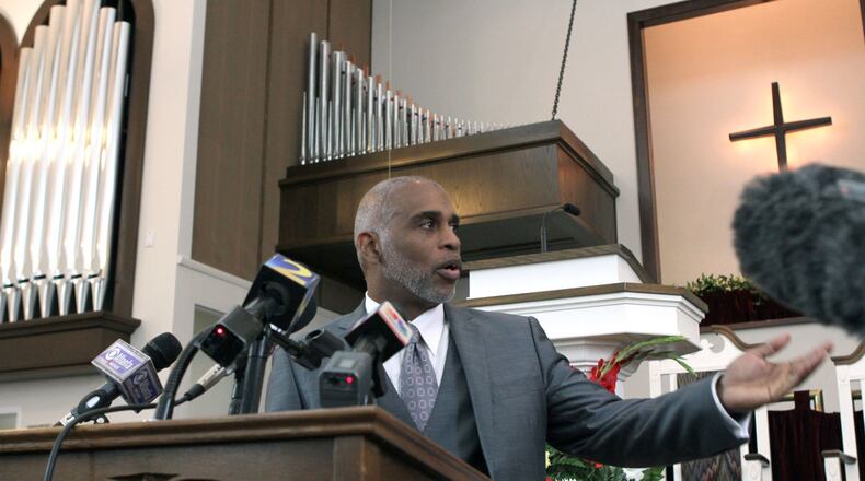 Lloyd Hawk, chairman of the board of trustees for Friendship Baptist Church, addresses the media following their vote to accept the $20 million offer from the Atlanta Falcons to secure their spot for a new stadium on Sunday.