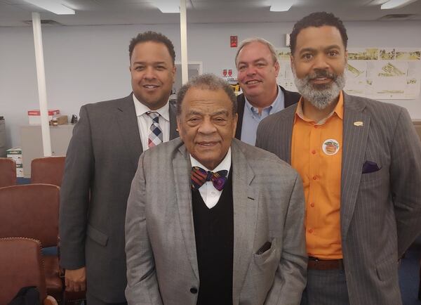 Fort McPherson redevelopment authority director Brian Hooker, right, with developer Stephen Macauley (looking over his shoulder) during happier times. Also pictured are former Mayor Andrew Young and authority chair Cassius Butts. Photo from LRA website