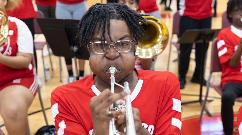 Tyler Gardner practices with the JHS Majestic Marching Cardinals at Jonesboro High School. (Steve Schaefer/steve.schaefer@ajc.com)