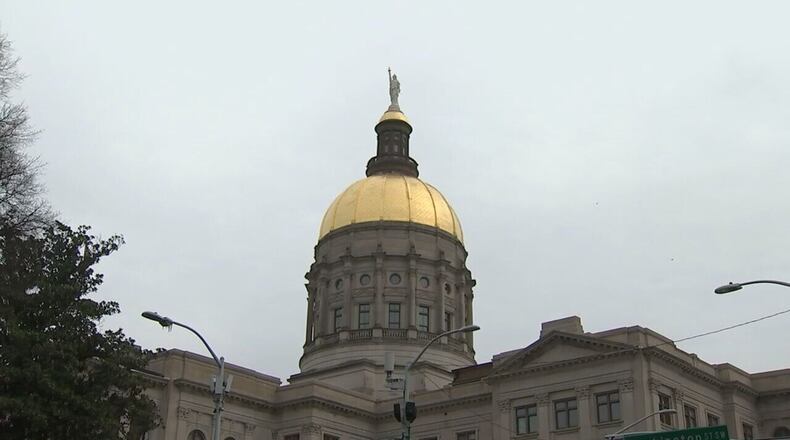 The Georgia state Capitol in Atlanta. Georgia needs to call a special session, redraw the political maps and delay the House primaries if needed, says Rep. Buddy Carter. (Jason Getz/AJC)