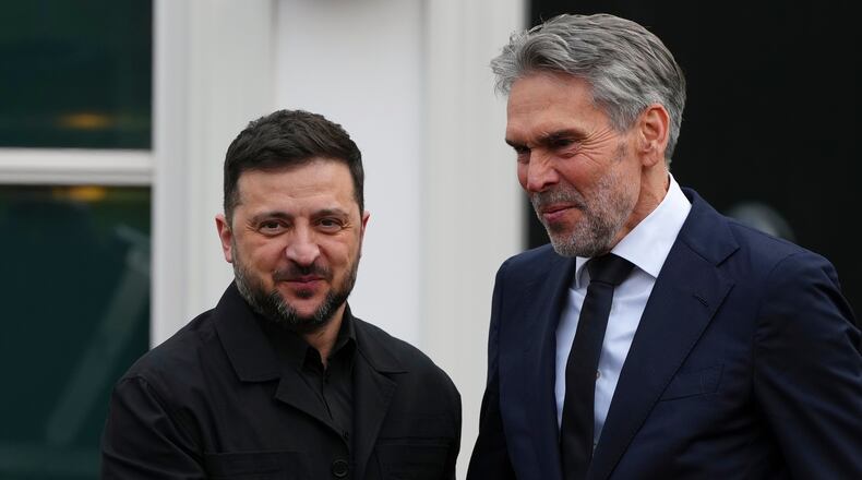 Dutch Prime Minister Dick Schoof, right, welcomes Ukraine's President Volodymyr Zelenskyy in The Hague, Netherlands, Tuesday, Dec. 16, 2025. (AP Photo/Peter Dejong)