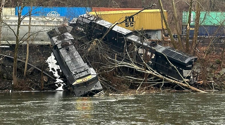 This photo provided by Nancy Run Fire Company shows a train derailment along a riverbank in Saucon Township, Pa., on Saturday, March 2, 2024. Authorities said it was unclear how many cars were involved but no injuries or hazardous materials were reported. (Nancy Run Fire Company via AP)