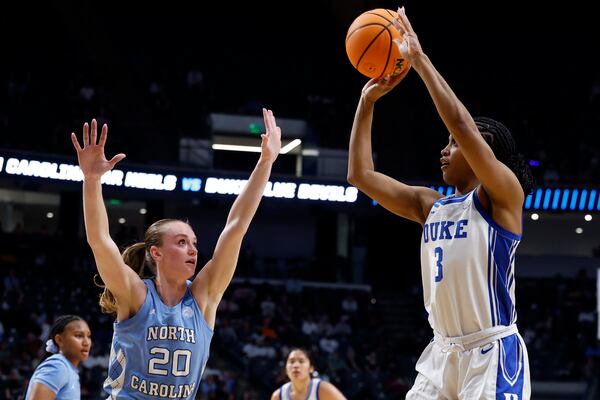 Duke guard Ashlon Jackson (3) shoots over North Carolina guard Lexi Donarski (20) during the first half in the Sweet 16 of the NCAA college basketball tournament, Friday, March 28, 2025, in Birmingham, Ala. (AP Photo/Butch Dill)