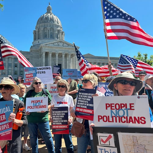 Protesters against a Missouri congressional redistricting plan gather outside the Missouri Capitol on Tuesday, May 12, 2026, in Jefferson City, Mo. (AP Photo/David A. Lieb)