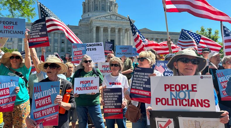 Protesters against a Missouri congressional redistricting plan gather outside the Missouri Capitol on Tuesday, May 12, 2026, in Jefferson City, Mo. (AP Photo/David A. Lieb)
