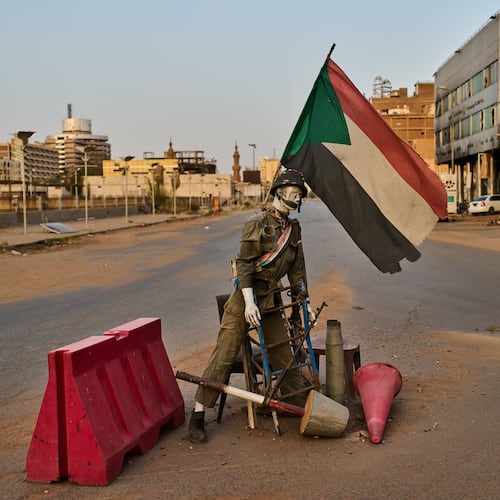 An empty checkpoint where a mannequin dressed as a soldier stands in downtown Khartoum, Sudan, Sunday, April 19, 2026. (AP Photo/Bernat Armangue)