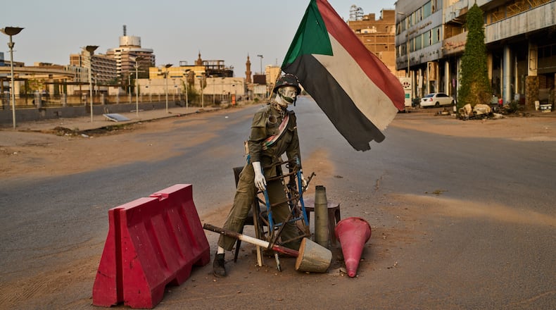 An empty checkpoint where a mannequin dressed as a soldier stands in downtown Khartoum, Sudan, Sunday, April 19, 2026. (AP Photo/Bernat Armangue)