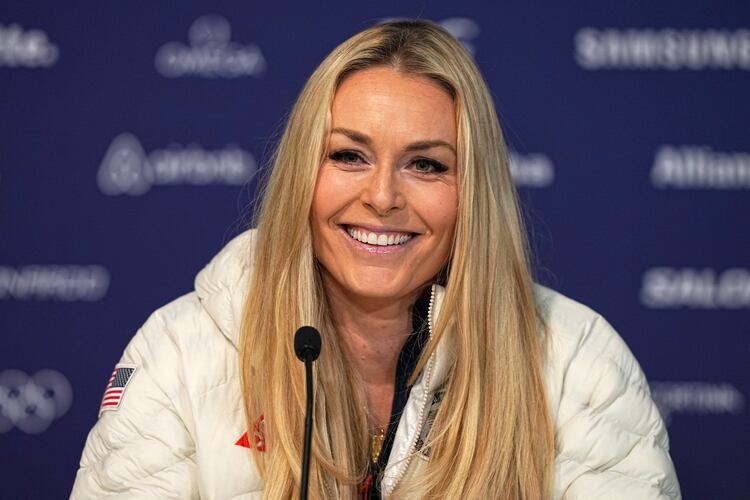 FILE - United States' Lindsey Vonn smiles during a press conference by the U.S. ski team at the 2026 Winter Olympics, in Cortina d'Ampezzo, Italy, Tuesday, Feb. 3, 2026. (AP Photo/Fatima Shbair, File)