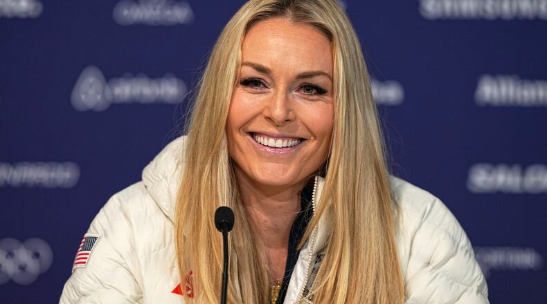 FILE - United States' Lindsey Vonn smiles during a press conference by the U.S. ski team at the 2026 Winter Olympics, in Cortina d'Ampezzo, Italy, Tuesday, Feb. 3, 2026. (AP Photo/Fatima Shbair, File)
