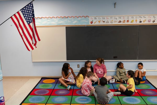 Jillian Murphy leads children in math activities during the East Providence Boys and Girls Club Summer Camp at Emma G. Whiteknact Elementary School on Thursday, July 10, 2025, in Providence R.I. (AP Photo/Sophie Park)