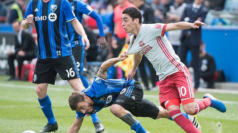Montreal Impact's Hernan Bernardello, left, challenges Atlanta United's Miguel Almiron during second half MLS soccer action in Montreal, Saturday, April 15, 2017.