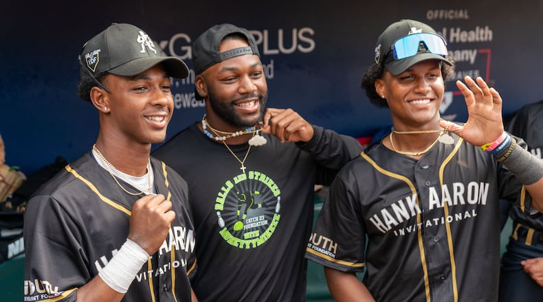 The Braves' Michael Harris II (middle) spends time with high school players at the Hank Aaron Invitational Saturday at Truist Park on August 3, 2024. (Photo by Lyndon Terrell for the Atlanta Braves)