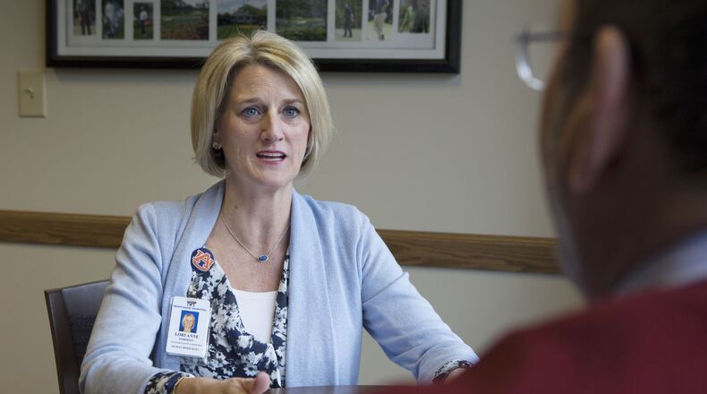 Lori Anne Roberson and Mark Rosenthal meet together at the Northside Hospital Human Resources department in Atlanta. November was a pretty good month for the job market. (Photo by Phil Skinner)