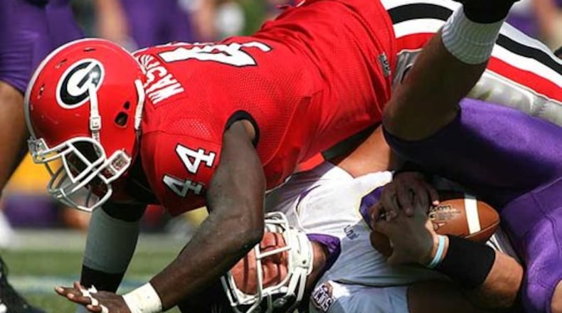 This is Marcus Washington Sr. playing linebacker for the Georgia Bulldogs in 2007. Washington's son of the same name has signed with the Bulldogs 17 years after his father, who is now defensive coordinator and strength and conditioning coach at Grovetown High near Augusta. (Photo by Brant Sanderlin/AJC)
