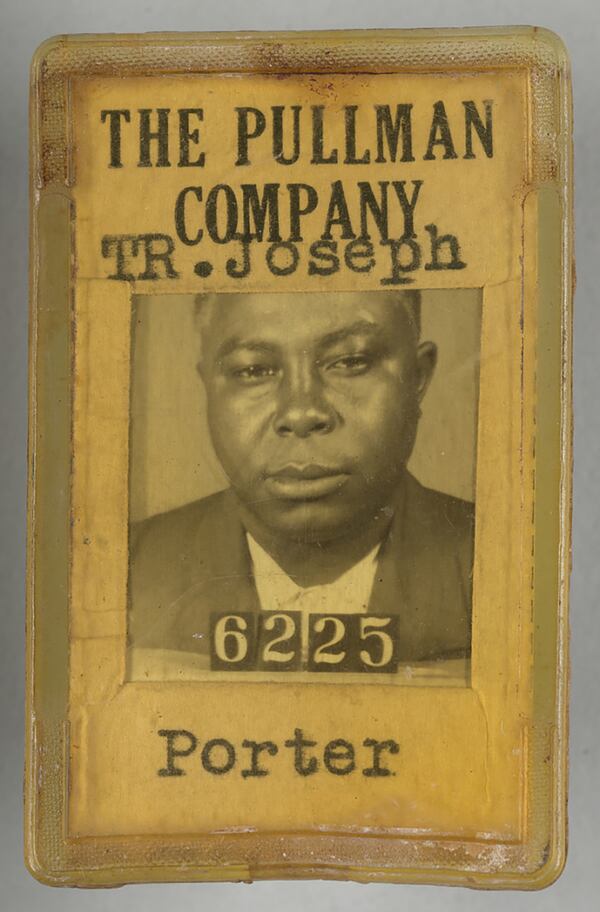 This ID badge from circa 1940 was used by T.R. Joseph, a porter with the Pullman Company. The back of the badge identified Joseph's age (36), height, weight, eye and hair color. (Sam Patton/Collection of the Smithsonian National Museum of African American History and Culture)