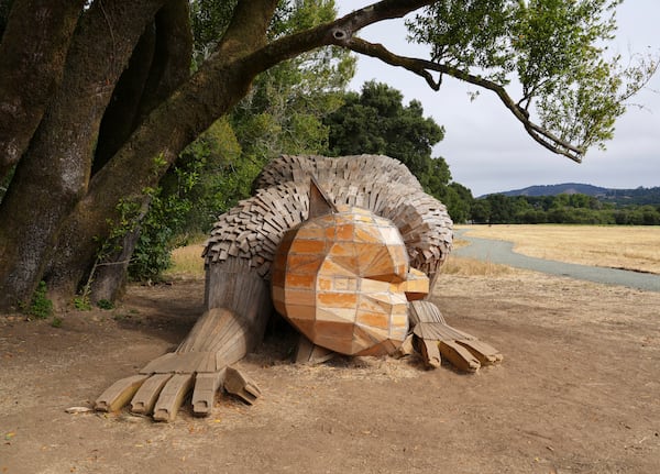 A giant troll sculpture created by the Danish recycle artist Thomas Dambo and his team that's part of an installation of six sculptures called "Trolls Save the Humans" is seen on display at the historic estate Filoli, Saturday, July 5, 2025, in Woodside, Calif. (AP Photo/Terry Chea)