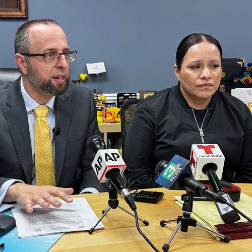 Patrick Kolasinski, attorney for Carlos Ivan Mendoza Hernandez, speaks at a news conference accompanied by his client's girlfriend, Cindy, in Modesto, Calif., Wednesday, April 8, 2026. (AP Photo/Terry Chea)