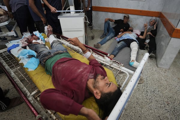 Wounded Palestinians are brought to Shifa Hospital in Gaza City after being injured while on their way to an aid distribution center, Thursday, July 3, 2025. (AP Photo/Jehad Alshrafi)