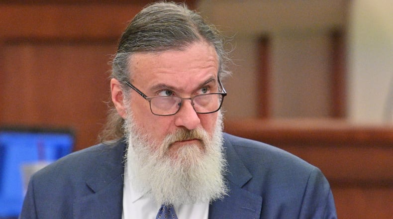 January 31, 2022 Americus - Attorney William McCall Calhoun sits next to his client Deontrey Parker (not pictured) during jury selection for alleged drug-related murder trial before Superior Court Judge Jimmie Brown (not pictured) at Sumter County Courthouse in Americus on Monday, January 31, 2022. Americus attorney William McCall Calhoun is out on bond and facing felony charges related to his activities at the U.S. Capitol on Jan. 6, 2021. While on bond, he is subject to home confinement and GPS monitoring (ankle monitor). (Hyosub Shin / Hyosub.Shin@ajc.com)