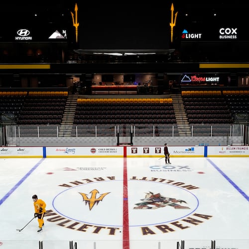 FILE - Members of the Arizona State University hockey team skate on the ice at the new Mullett Arena, Oct. 24, 2022, in Tempe, Ariz. (AP Photo/Ross D. Franklin, File)