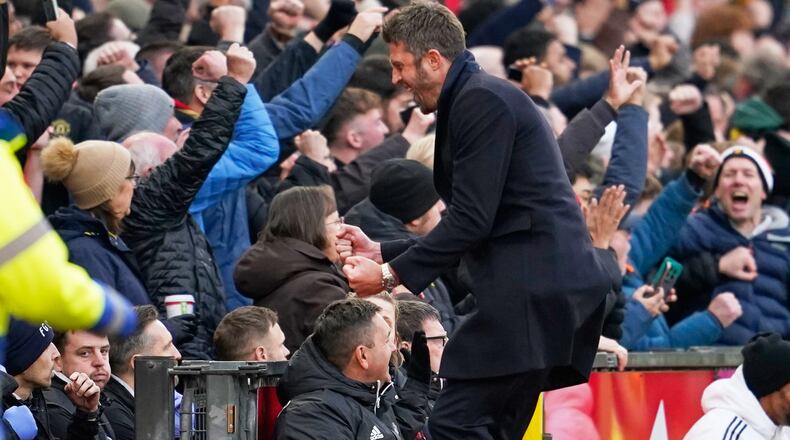 Manchester United's head coach Michael Carrick celebrates during the English Premier League soccer match between Manchester United and Manchester City in Manchester, England, Saturday, Jan. 17, 2026. (AP Photo/Dave Thompson)