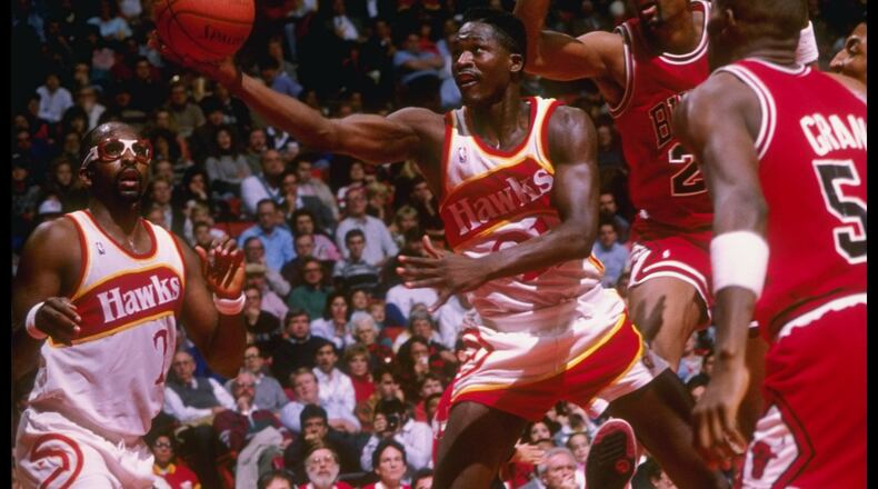 In his first season with Atlanta, Moses Malone (left) teamed up with Dominique Wilkins and the center averaged 20.2 points per game.