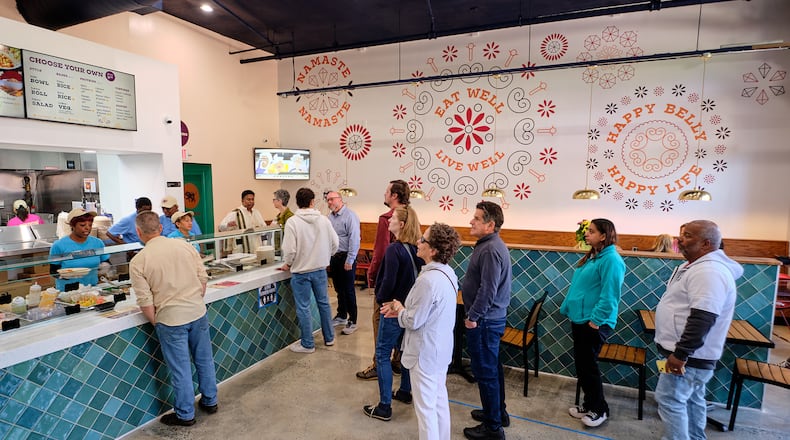 You move down the cafeteria-style line at the counter of Sankranti Indian Kitchen and pick the ingredients for your customized curry bowl. Courtesy of Brandon Amato