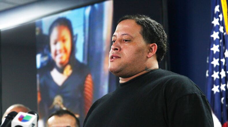 Christopher Cevilla, father of 7-year-old Jazmine Barnes, speaks during a Dec. 31 news conference in Houston. Authorities are seeking the public's help in locating a man in a pickup truck who pulled up next to a car that was leaving a Houston-area Walmart parking lot Sunday and started shooting, killing Barnes inside the car and wounding the girl's mother.