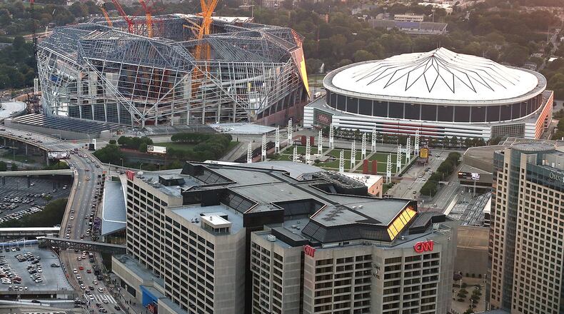 082516 ATLANTA: Mercedes-Benz Stadium, the new home of the Atlanta Falcons, continues to take shape beside the Georgia Dome as seen on Thursday, August 25, 2016, in Atlanta. Curtis Compton /ccompton@ajc.com