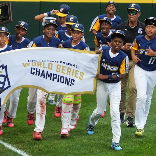 Curacao takes a victory lap after winning the Little League World Series Championship baseball game against Henderson, Nev., in South Williamsport, Pa., Sunday, Aug. 30, 2026. (AP Photo/Gene J. Puskar)