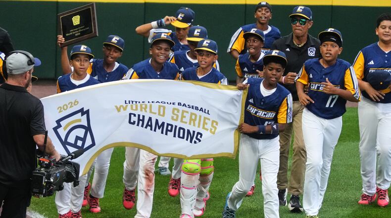 Curacao takes a victory lap after winning the Little League World Series Championship baseball game against Henderson, Nev., in South Williamsport, Pa., Sunday, Aug. 30, 2026. (AP Photo/Gene J. Puskar)
