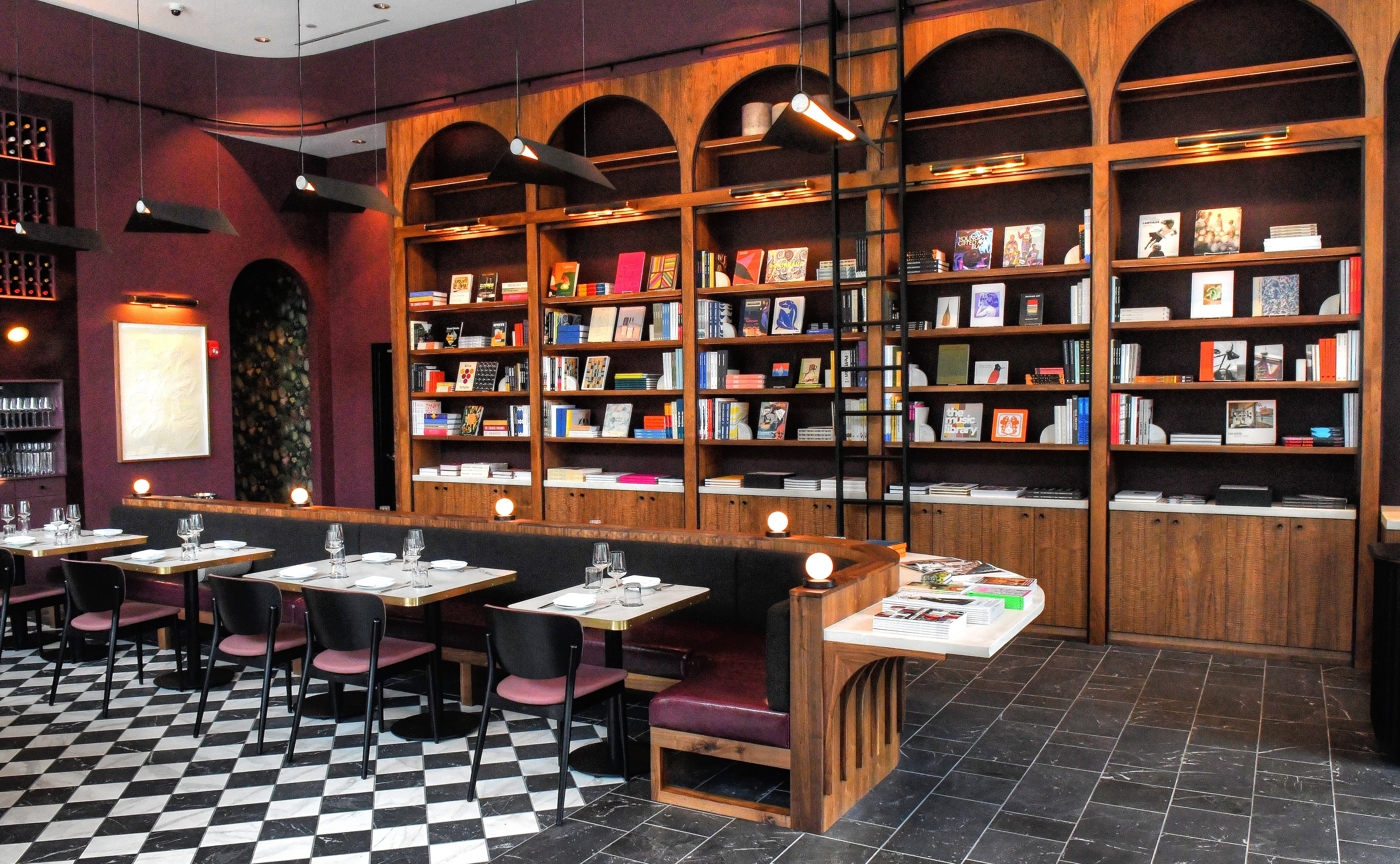 “It’s been really wonderful to see how many people come in for food and wine, and then after looking at the bookshelves during their meal, they end up on that side, and take home books,” Lucian Books and Wine co-owner Katie Barringer said when the restaurant opened in 2021. (Chris Hunt for the AJC)