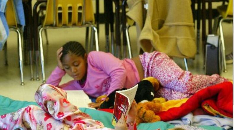 Lake Windward, the top scoring elementary school in metro Atlanta in third-grade language arts, has fostered reading through such events as “Writing and Reading All Day” in which means students and staff wear their pajamas all day to read and write. (PHOTO BY PHIL SKINNER/staff)