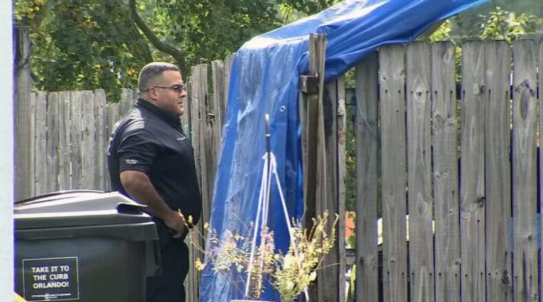 The body of a 44-year-old man was found at a home where a freshly dug hole was. (Photo: WFTV.com)